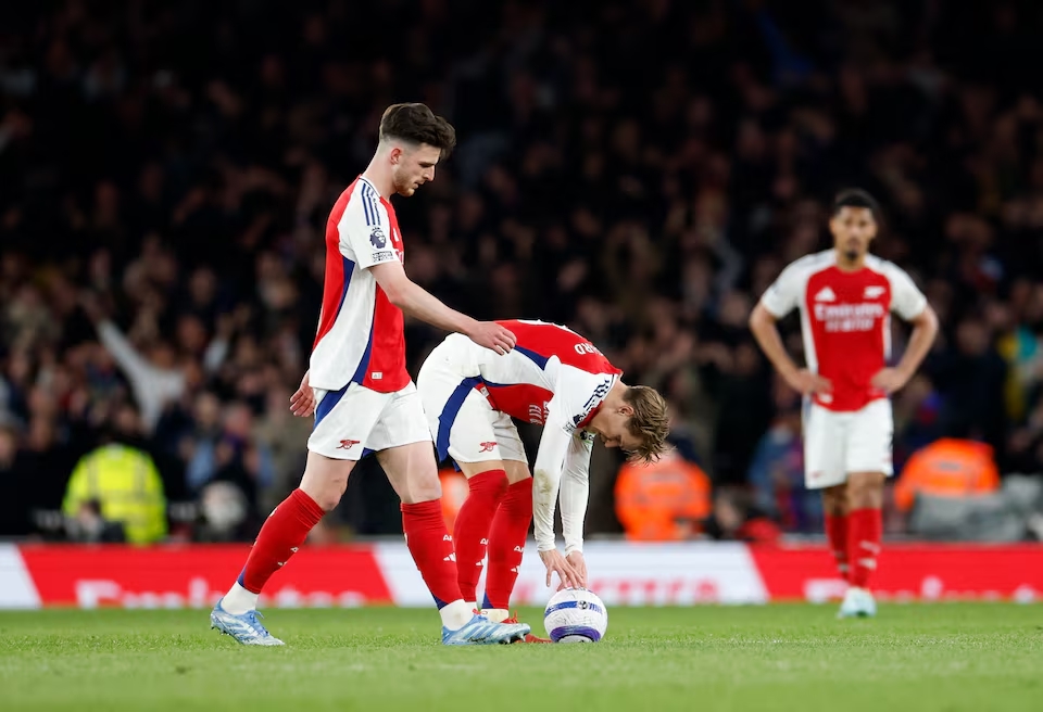 Arsenal's Declan Rice and Martin Odegaard look dejected after Crystal Palace's Jean-Philippe Mateta scores their second goal. (Reuters)