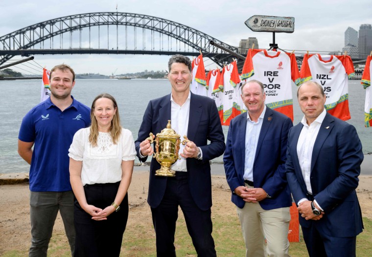 Australian rugby great John Eales holds the Webb Ellis Cup during the release of the official match schedule for the Rugby World Cup 2027. AFP