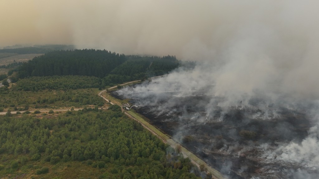 This aerial photograph shows a wildfire burning in the Hautes Fagnes (High Fens) nature reserve in Waimes on August 15, 2026. (AFP)