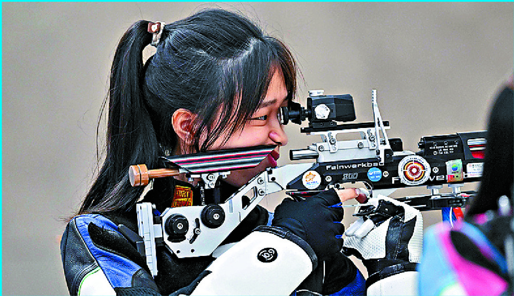 Huang Yuting is on target in the women's 10m air rifle event while rowers Zou Jiaqi and Qiu Xiuping win the lightweight women's double sculls. AFP