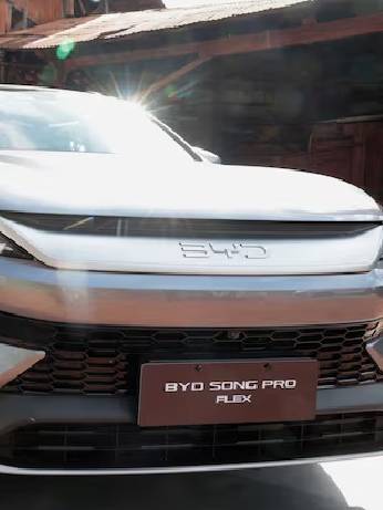 A person looks at a BYD Song Pro Flex vehicle during the launch of the Chinese automaker's first Brazilian-made plug-in hybrid flex-fuel car at the Museu da Cana in Sertaozinho, Sao Paulo state, Brazil, August 4, 2026. REUTERS/Joel Silva/File Photo