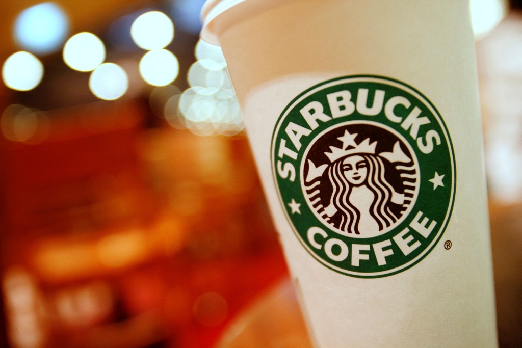 A cup of Starbucks coffee sits on a table in a cafe in central Hong Kong January 16, 2011.  REUTERS
