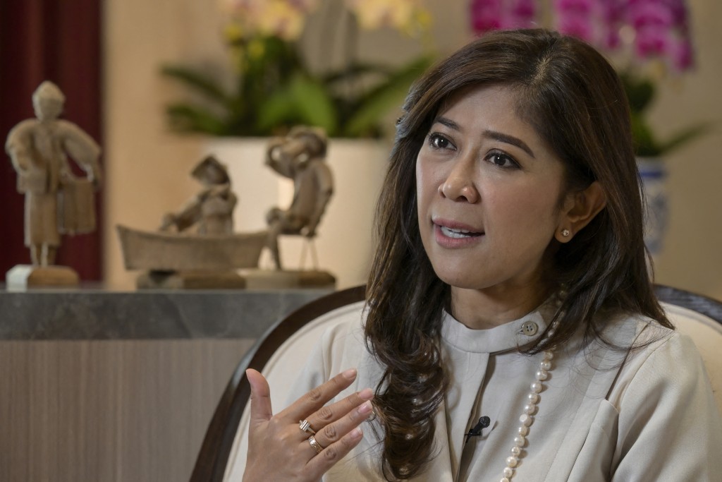Photo by BAY ISMOYO / AFP  Indonesia's Communication and Digital Affairs Minister Meutya Hafid answers questions during an interview with AFP at her official residence in Jakarta on May 6, 2026.