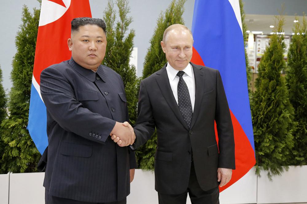 Russian President Vladimir Putin, right, and North Korea's leader Kim Jong Un shake hands during their meeting in Vladivostok, Russia, April 25, 2019. As the war in Ukraine stretches into its seventh month, North Korea is hinting at its interest in sending construction workers to help rebuild Russian-occupied territories in the country's east. (AP) Russian President Vladimir Putin, right, and North Korea's leader Kim Jong Un shake hands during their meeting in Vladivostok, Russia, April 25, 2019. As the war in Ukraine stretches into its seventh month, North Korea is hinting at its interest in sending construction workers to help rebuild Russian-occupied territories in the country's east. (AP)
