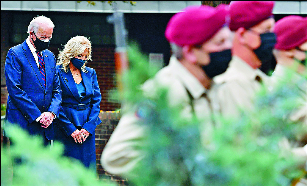 Joe Biden and wife Jill mark Veteran's Day at the Korean War Memorial Park in Philadelphia while Donald Trump lays a wreath at the Tomb of the Unknown Soldier in Arlington. AFP Joe Biden and wife Jill mark Veteran's Day at the Korean War Memorial Park in Philadelphia while Donald Trump lays a wreath at the Tomb of the Unknown Soldier in Arlington. AFP
