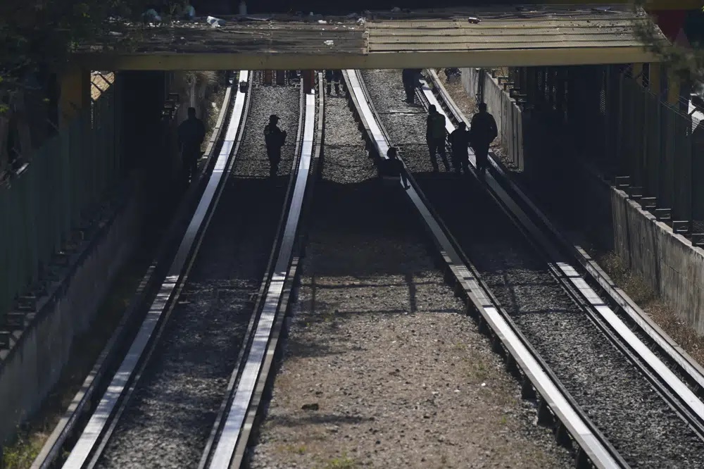 Rescue workers inspect rail lines after two subway trains collided, in Mexico City, Saturday, Jan. 7, 2023. Authorities announced at least one person was killed and dozens were injured in the Saturday accident on Line 3 of the capital's subway. (AP) Rescue workers inspect rail lines after two subway trains collided, in Mexico City, Saturday, Jan. 7, 2023. Authorities announced at least one person was killed and dozens were injured in the Saturday accident on Line 3 of the capital's subway. (AP)