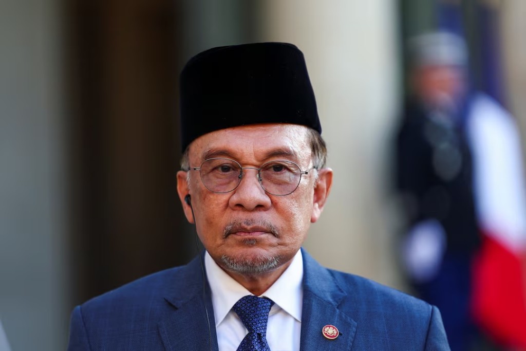 Malaysian Prime Minister Anwar Ibrahim attends a joint statement with French President Emmanuel Macron (not pictured), before a working dinner at the Elysee Palace, in Paris, France, July 4, 2025. REUTERS/Abdul Saboor 