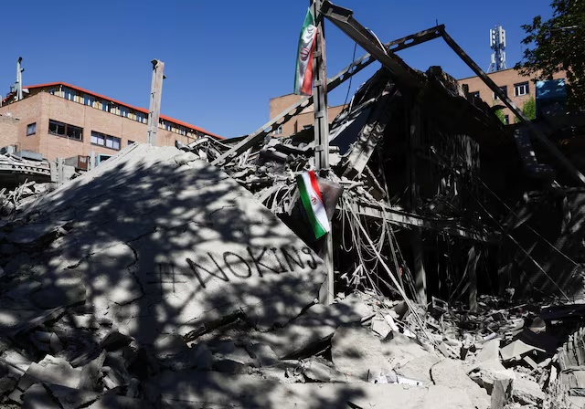 An Iranian flag hangs amidst the rubble of a building of the Sharif University of Technology, which was damaged in a strike, amid the U.S.-Israeli conflict with Iran, in Tehran, Iran, April 7, 2026. Majid Asgaripour/WANA (West Asia News Agency) via REUTERS/File Photo Purchase Licensing Rights