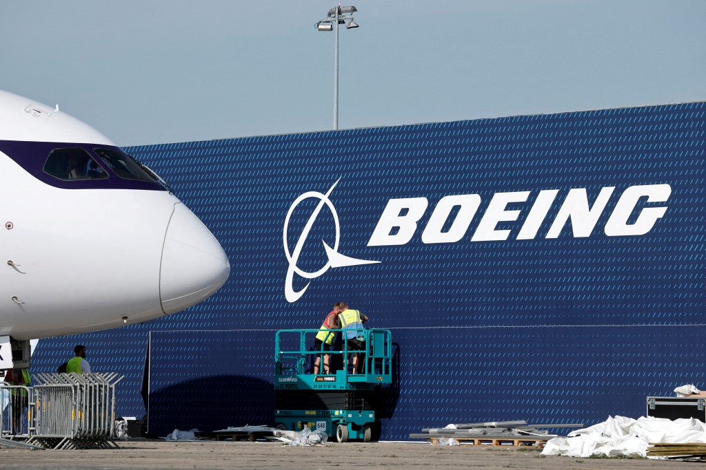 FILE PHOTO: A Boeing logo is seen before the opening of the 55th International Paris Airshow at Le Bourget Airport near Paris, France, June 13, 2025. REUTERS/Benoit Tessier/File Photo