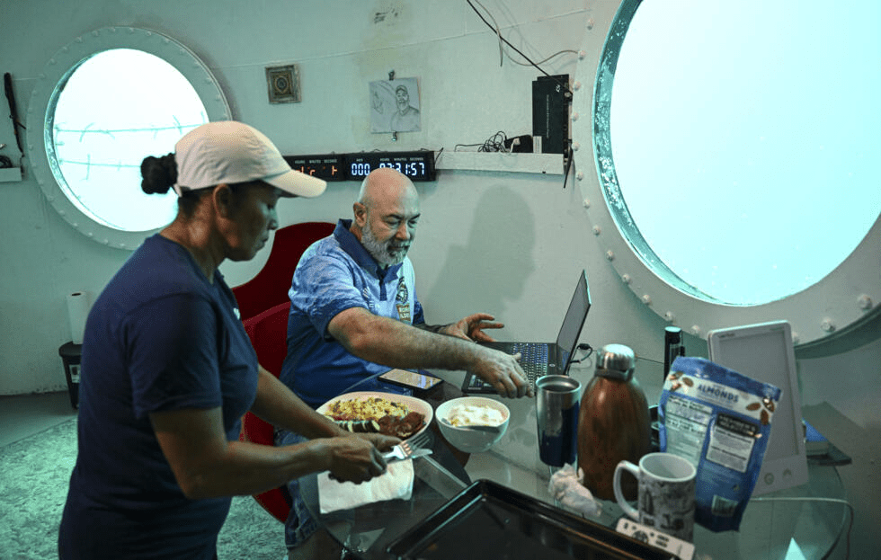 Rudiger Koch has breakfast in his underwater home before emerging as a world record holder © MARTIN BERNETTI / AFP Rudiger Koch has breakfast in his underwater home before emerging as a world record holder © MARTIN BERNETTI / AFP