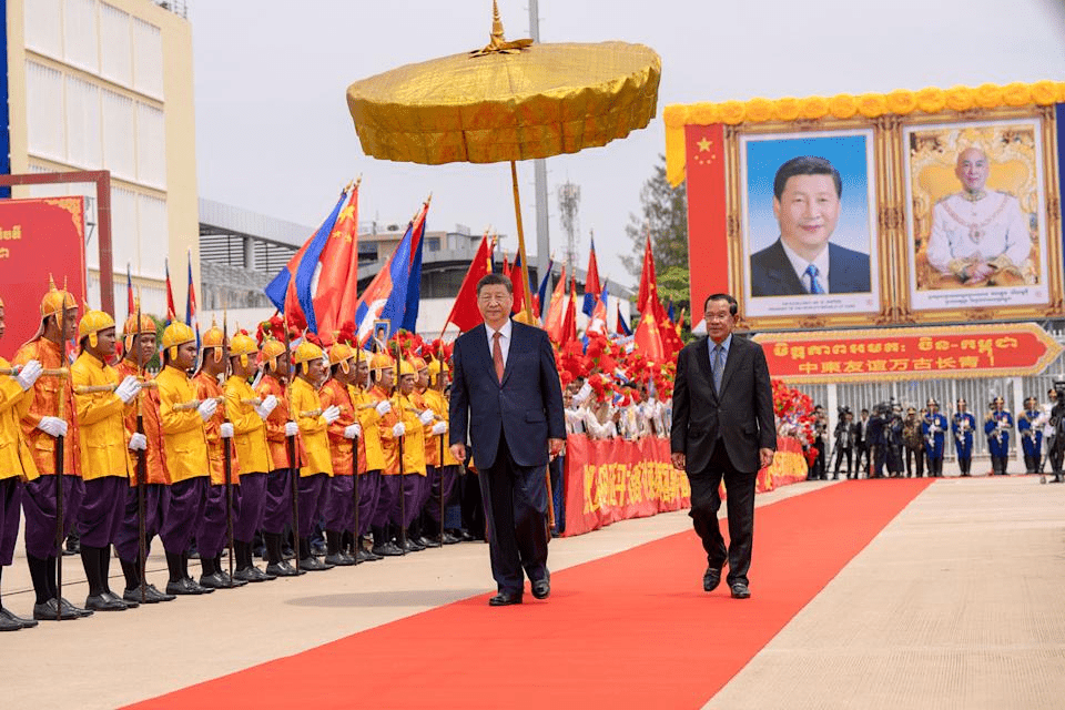 In this photo released by Agence Kampuchea Press (AKP), Chinese President Xi Jinping reviews the Royal Palce honorary guards as he is accompanied by Cambodian Senate President Hun Sen, right, during a send-off ceremony at Phnom Penh International Airport in Phnom Penh, Cambodia, Friday, April 18, 2025. (AKP via AP)