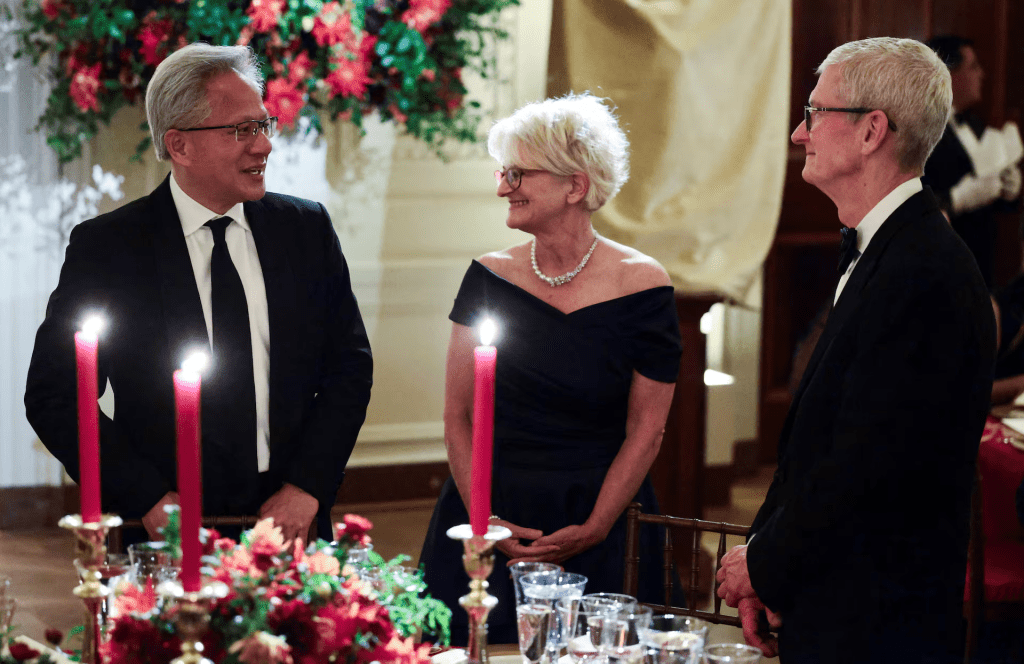Nvidia CEO Jensen Huang and his wife Lori Huang and Tim Cook, chairman of the board of directors of Apple, attend a state dinner hosted by US President Donald Trump and first lady Melania Trump for Chinese President Xi Jinping and his wife, Peng Liyuan, at the White House in Washington, D.C., US, September 24, 2026. REUTERS/Evelyn Hockstein