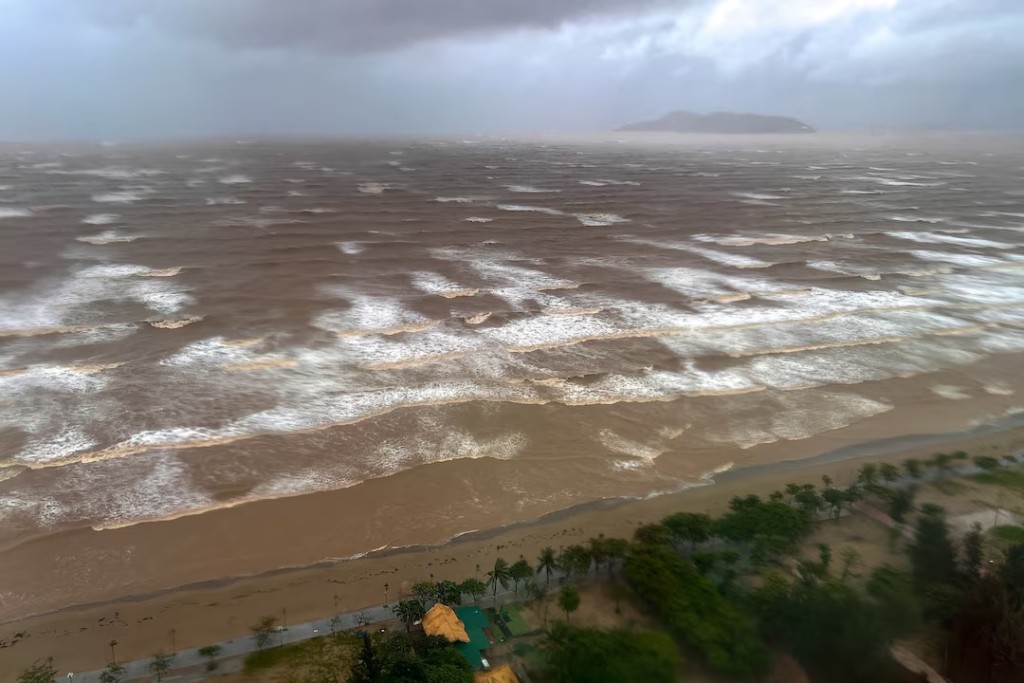 Waves approach Cua Lo beach, as seen through a window, while Typhoon Kajiki approaches in Nghe An province, Vietnam, August 25, 2025. (REUTERS/Minh Nguyen)