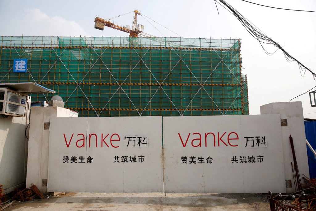 A China Vanke logo is seen at a gate of a construction site in Shanghai, China, March 21, 2017. REUTERS/Aly Song//File Photo