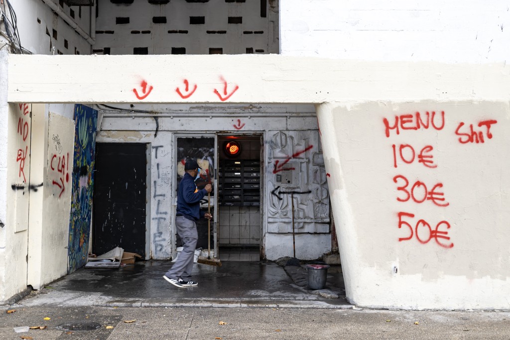 This photograph shows graffitis indicating drug prices on the walls of The Bel Horizon tower, located in the 3rd arrondissement of Marseille, on December 3, 2025.
