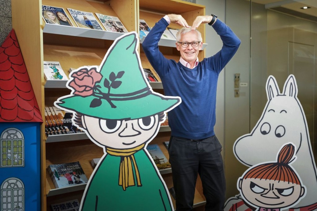 Timo Kantola with Snufkin, a Moomin character created by Finnish author Tove Jansson