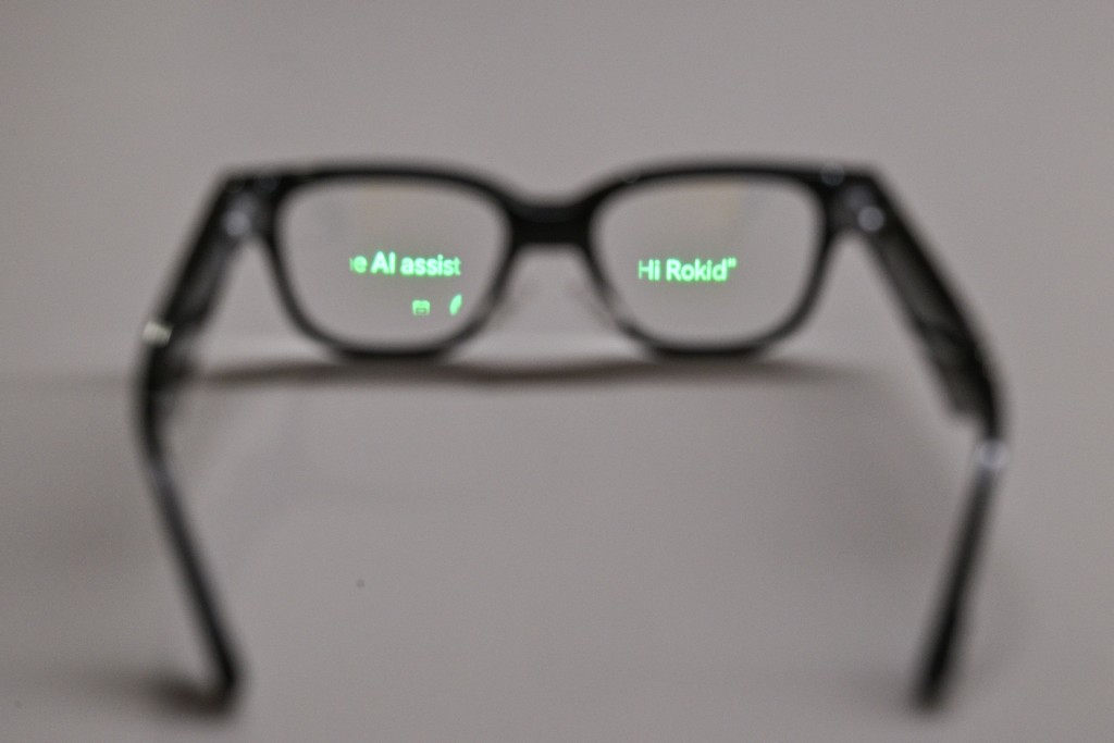 Photo by HECTOR RETAMAL / AFP  In this picture taken on November 13, 2025, a pair of Rokid glasses show its display that uses artificial intelligence (AI) and augmented reality (AR) at the offices of Rokid glasses in Hangzhou, in China's eastern Zhejiang province.