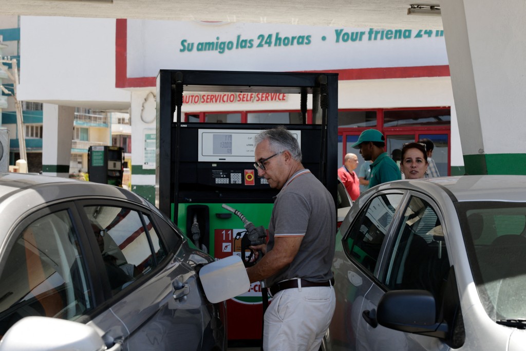 A driver fills up his tank as Cuba announces new and variable fuel prices at the pump beginning on May 15 to better reflect the actual costs of importing gas and diesel amid an ongoing U.S. fuel blockade, in Havana, Cuba, May 12, 2026. REUTERS
