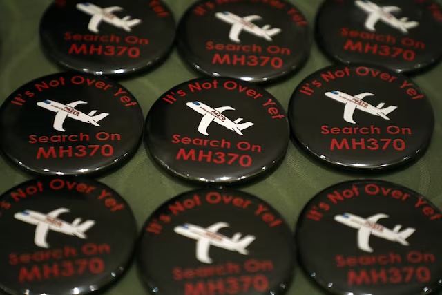 Badges are displayed during the sixth annual remembrance event for the missing Malaysia Airlines flight MH370 in Putrajaya, Malaysia, March 7, 2020. REUTERS/Lim Huey Teng