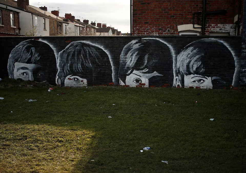 A mural of the Beatles is seen painted on the end of a row of terraced houses in Liverpool, northern England. (Reuters) A mural of the Beatles is seen painted on the end of a row of terraced houses in Liverpool, northern England. (Reuters)