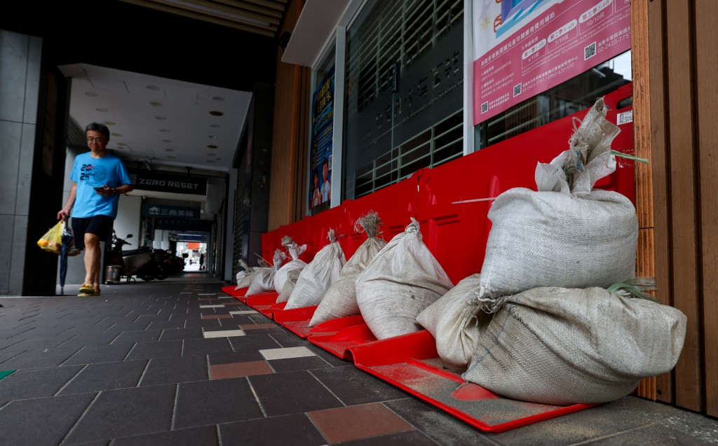 Sandbags are stacked outside a building ahead of the arrival of Typhoon Bavi in Keelung on July 10, 2026 (Photo by I-Hwa Cheng / AFP)