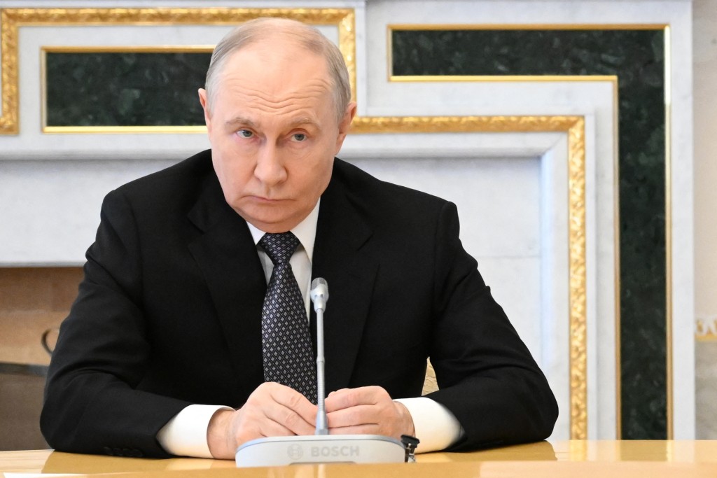 In this pool photograph distributed by the Russian state agency Sputnik, Russia's President Vladimir Putin attends a meeting with US special envoy in Saint Petersburg on October 21, 2026. (Photo by Kristina Solovyova / POOL / AFP)