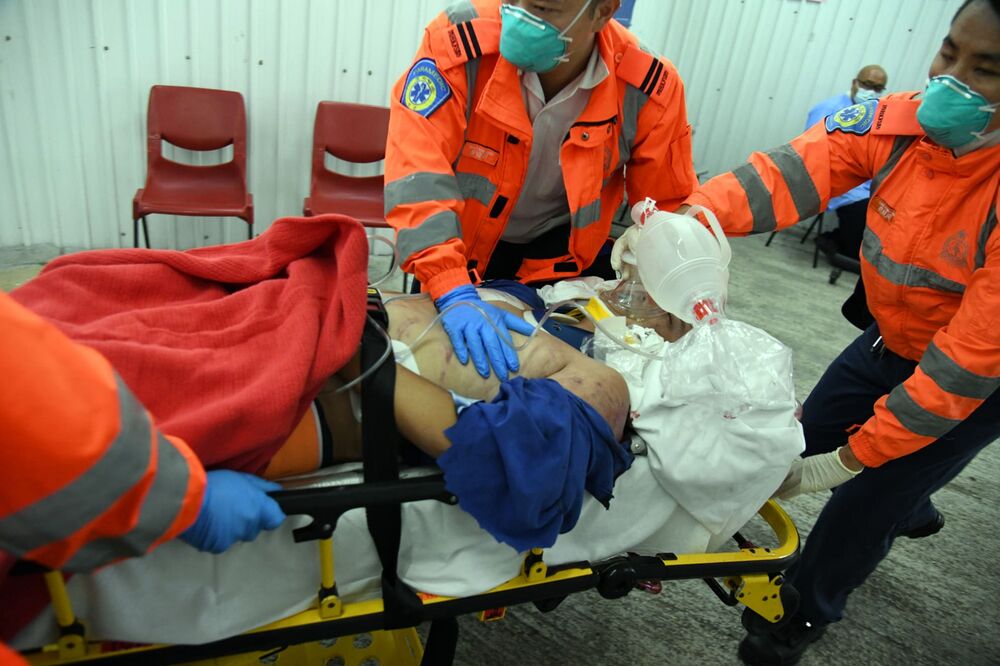 Assistant engineer Poon was rushed to hospital after being recovered from under the rubble. sing tao Assistant engineer Poon was rushed to hospital after being recovered from under the rubble. sing tao