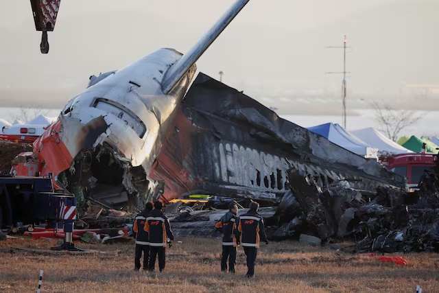 Firefighters take a look at the wreckage of the aircraft that crashed after it went off the runway, at Muan International Airport, in Muan, South Korea, December 31, 2024. REUTERS/Kim Hong-Ji/File Photo Firefighters take a look at the wreckage of the aircraft that crashed after it went off the runway, at Muan International Airport, in Muan, South Korea, December 31, 2024. REUTERS/Kim Hong-Ji/File Photo