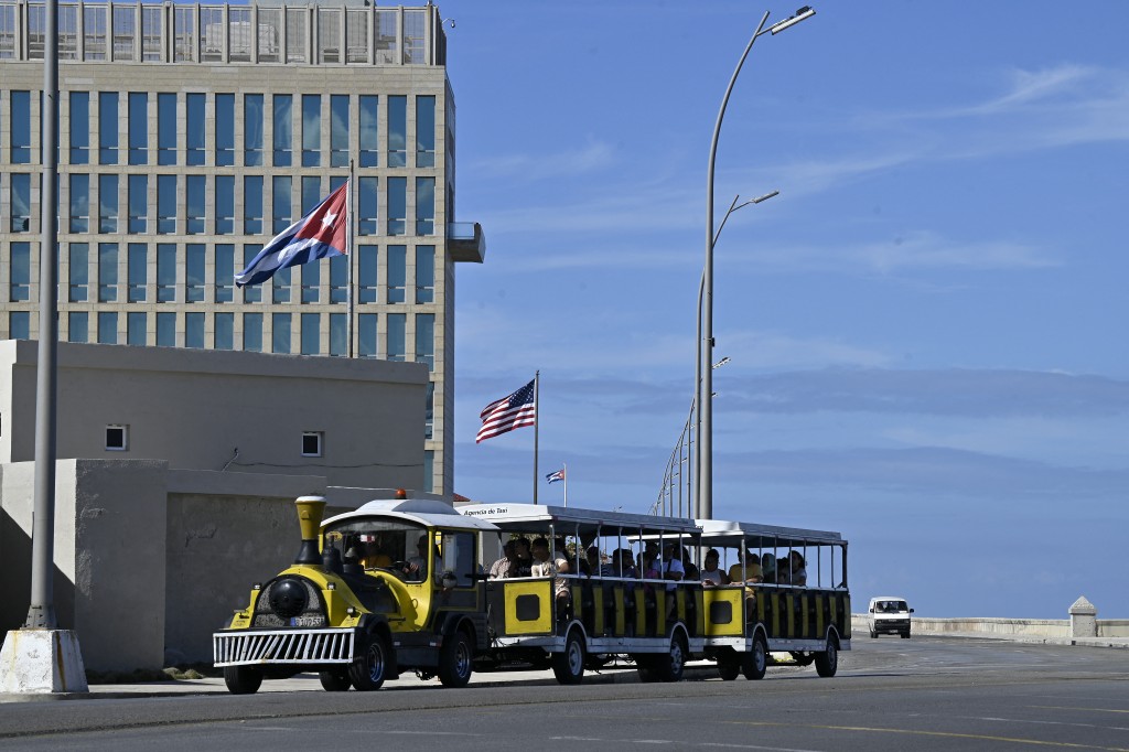 A tourist train rides past the US embassy in Havana on January 11, 2026. (AFP)