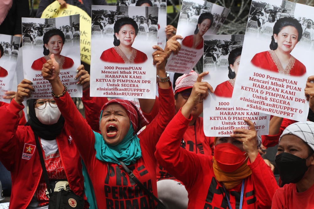 Activists and domestic workers call for lawmaker Puan Maharani to pass the Domestic Workers Protection Bill during a Women’s Day protest in Jakarta on March 8. (AFP) Activists and domestic workers call for lawmaker Puan Maharani to pass the Domestic Workers Protection Bill during a Women’s Day protest in Jakarta on March 8. (AFP)