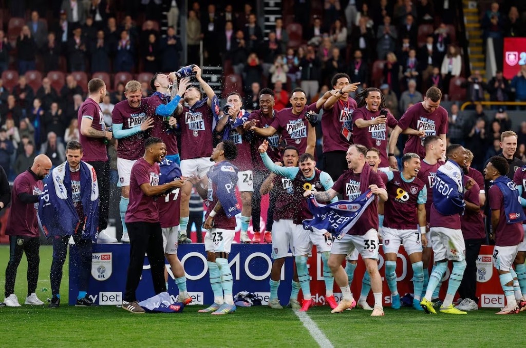 Burnley players celebrate after being promoted to the Premier League. (Reuters)