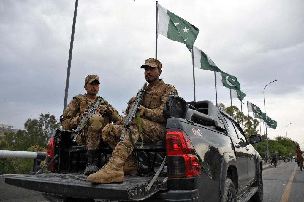 Army soldiers patrol a road as Pakistan prepares to host U.S. and Iran for the second round of peace talks in Islamabad, Pakistan, April 24, 2026. REUTERS/Waseem Khan