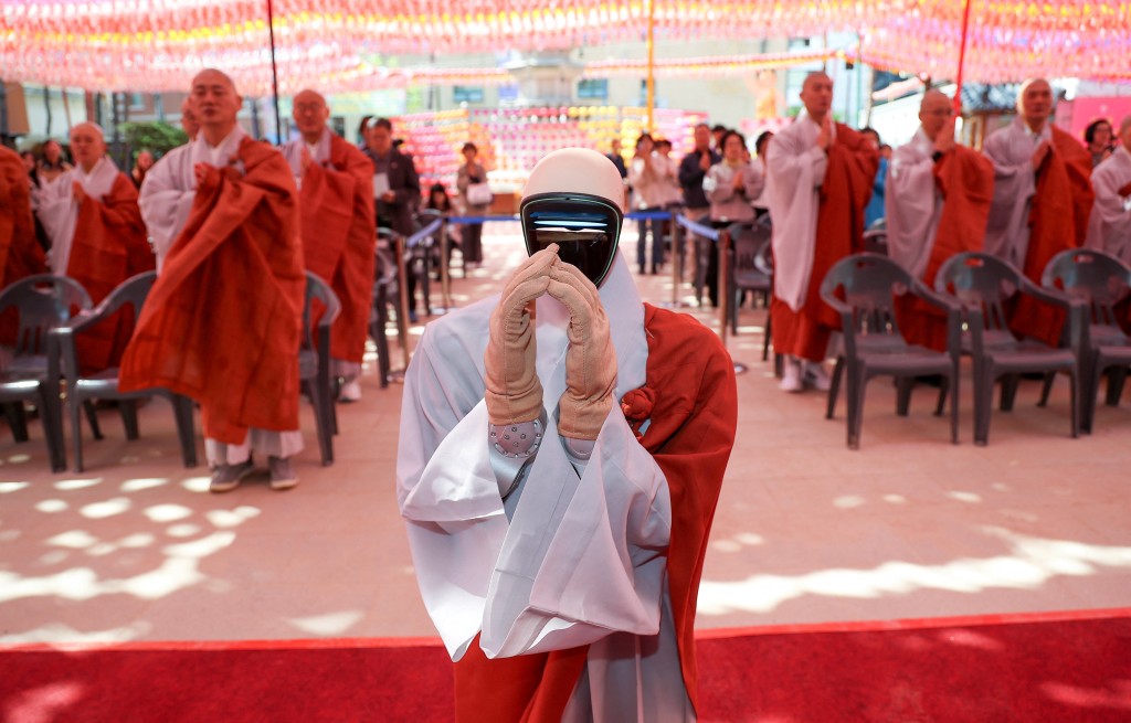 Humanoid robot Gabi folds its hands during a ceremony at a temple in Seoul. REUTERS