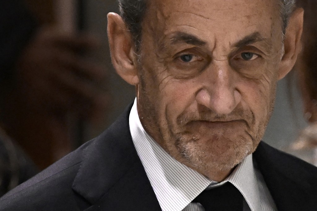 Former French president Nicolas Sarkozy leaves after the verdict in his trial for illegal campaign financing from Libya for his successful 2007 presidential bid, at the Tribunal de Paris courthouse in Paris, on September 25. (AFP)