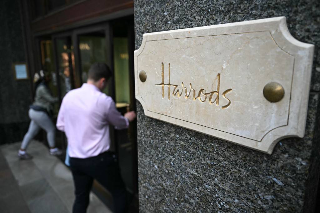Photo by BEN STANSALL / AFP Shoppers enter Harrods department store in west London on September 20, 2024.