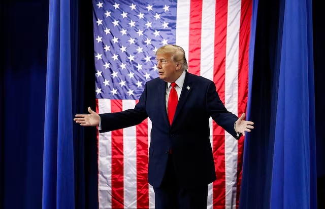 US President Donald Trump reacts as he walks on stage at the Curtis D. Menard Memorial Sports Center in Wasilla, Alaska, US, October 13, 2026. REUTERS/Evan Vucci 