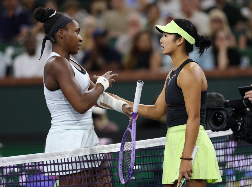 Coco Gauff, left, talks to Alex Eala about her injury after retiring from their third-round match. AFP