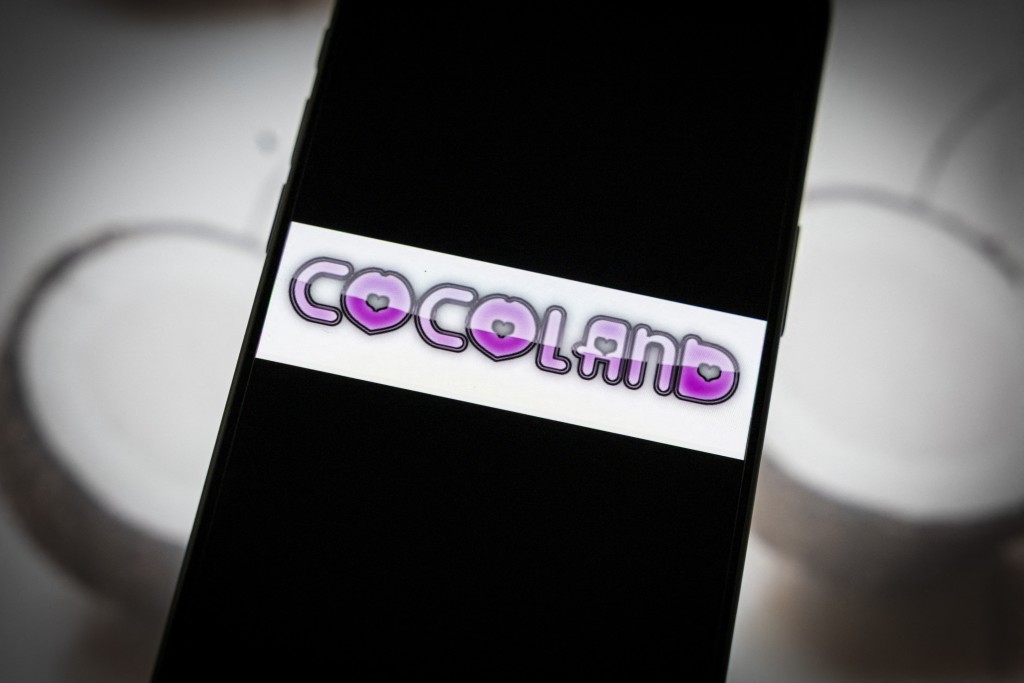 Photo by SIMON WOHLFAHRT / AFP  This photograph shows the logo of "Cocoland" website displayed on a smartphone in Paris on April 28, 2026.