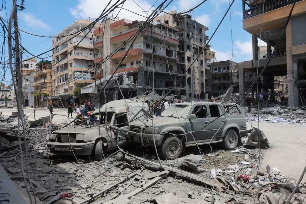 People gather at the site of an Israeli strike carried out last week, in Tyre, Lebanon, June 2, 2026. REUTERS/Aziz Taher