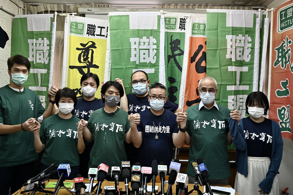 The union, led by Leo Tang and Joe Wong, center, will decide its next move on October 3.SING TAO The union, led by Leo Tang and Joe Wong, center, will decide its next move on October 3.SING TAO