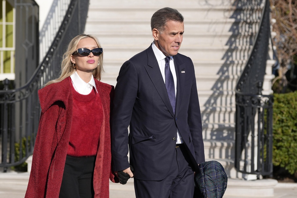 Hunter Biden and his wife Melissa Cohen Biden follow President Joe Biden and first lady Jill Biden as they walk to Marine One for departure from the South Lawn of the White House, Friday, Jan. 17, 2025, in Washington. (AP Photo/Alex Brandon) Hunter Biden and his wife Melissa Cohen Biden follow President Joe Biden and first lady Jill Biden as they walk to Marine One for departure from the South Lawn of the White House, Friday, Jan. 17, 2025, in Washington. (AP Photo/Alex Brandon)