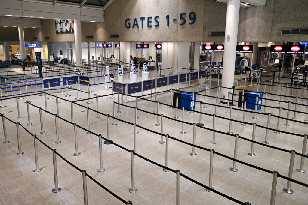 Photo by MIGUEL J. RODRIGUEZ CARRILLO / AFP  The TSA counter stands empty at Orlando International Airport in Orlando, Florida on October 30, 2025.