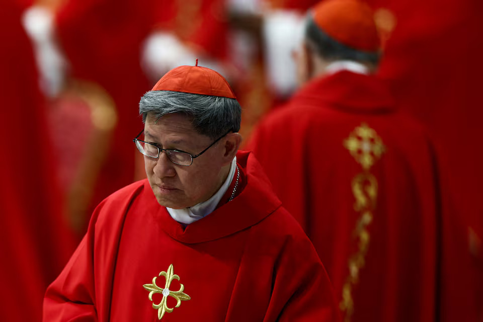 Cardinal Luis Antonio Tagle attends a mourning Mass for Pope Francis on the fifth day of Novendiali (nine days of mourning after the Pope's funeral) at St. Peter's Basilica at the Vatican, April 30, 2025. REUTERS/Guglielmo Mangiapane/File Photo
