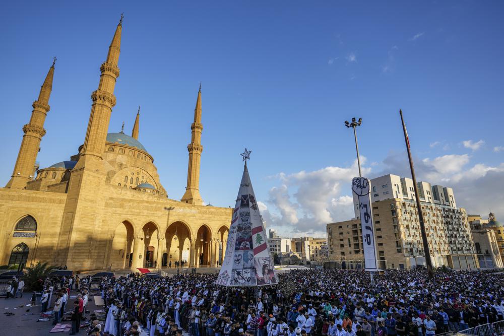 Muslim worshippers pray during Eid al-Fitr morning prayer outside the Mohammad al-Amin Mosque in downtown of Beirut, Lebanon. (AP) Muslim worshippers pray during Eid al-Fitr morning prayer outside the Mohammad al-Amin Mosque in downtown of Beirut, Lebanon. (AP)