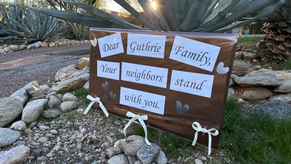 Neighbors left a message to encourage Guthrie's family. AP