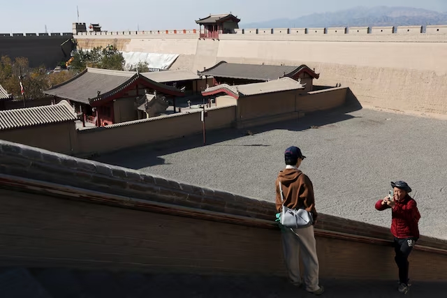 Tourists visit Jiayu Pass, a strategic point of the Great Wall of the Ming Dynasty along the ancient "Silk Road", in Jiayuguan, Gansu province, China October 28, 2024. (Reuters)