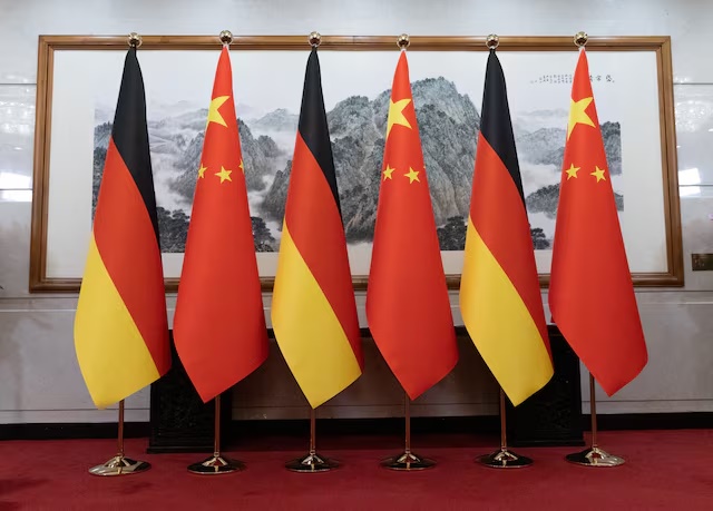 German and Chinese flags are displayed at the Diaoyutai State Guesthouse in Beijing, China, 25 February, 2026. JESSICA LEE/Pool via REUTERS