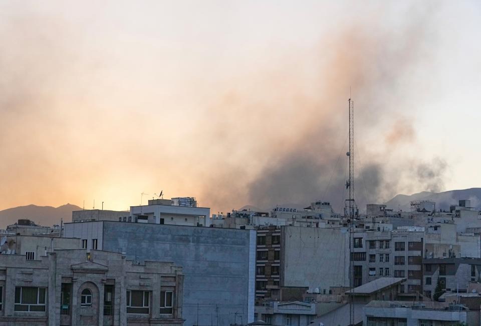Smoke rises up after Israel's attack, in Tehran, Iran, Wednesday, June 18, 2025. (AP Photo/Vahid Salemi)