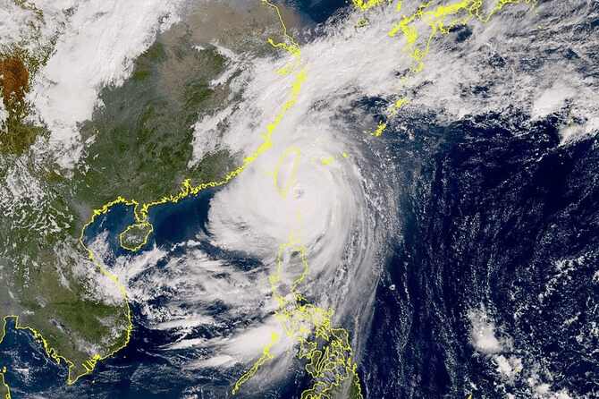 This Himawari satellite handout image from the Japan Meteorological Agency (JMA) website shows typhoon Kong-rey developing over the Pacific as it approaches Taiwan (center L). Taiwan shut down on October 31 as Super Typhoon Kong-rey neared, forcing thousands to flee from one of the most powerful storms to threaten the island in years. (AFP) This Himawari satellite handout image from the Japan Meteorological Agency (JMA) website shows typhoon Kong-rey developing over the Pacific as it approaches Taiwan (center L). Taiwan shut down on October 31 as Super Typhoon Kong-rey neared, forcing thousands to flee from one of the most powerful storms to threaten the island in years. (AFP)
