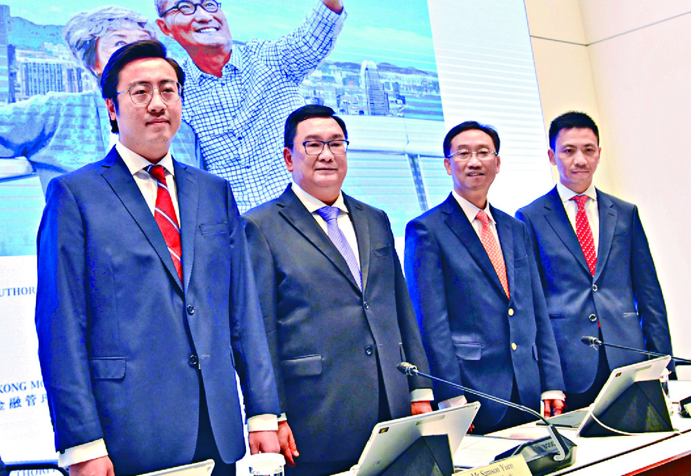 Revealing the details of the bonds are, from left, Arnold Chow, deputy general manager for investment and insurance at the personal digital banking product department of BOC Hong Kong, HKMA head of currency and settlement Samson Yuen, Edmond Lau, and Revealing the details of the bonds are, from left, Arnold Chow, deputy general manager for investment and insurance at the personal digital banking product department of BOC Hong Kong, HKMA head of currency and settlement Samson Yuen, Edmond Lau, and